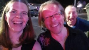 a very blurry picture of three people laughing into the camera