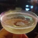 a wide champagne glass of bubbly