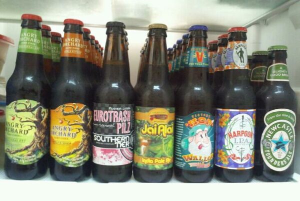 neat rows of beer bottles in a fridge