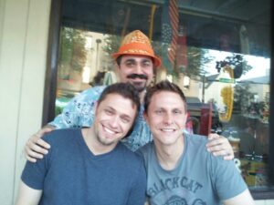 three people posing awkwardly for a group shot