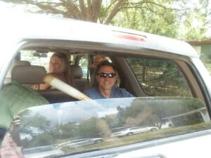 several people in the back of an SUV