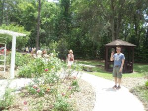 several people walking along a garden path