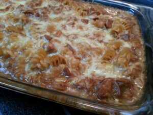 close up of a pasta casserole covered in cheese