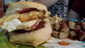 close up of a sandwich with a bite out of it