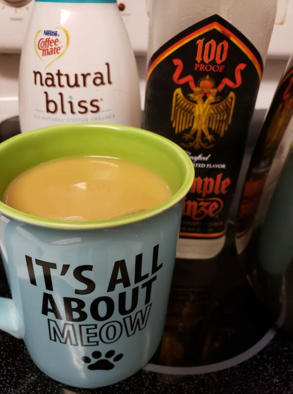a coffee mush with rumple mintz in the background