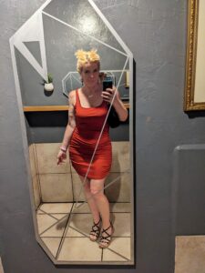 selfie in a red dress and a vintage angular mirror