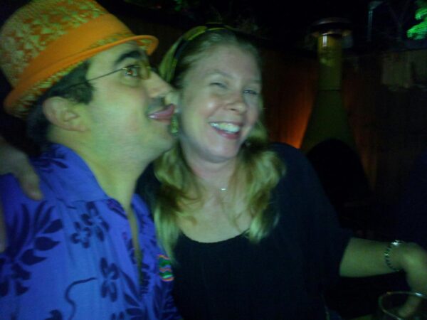 blurry picture of a person licking in the direction of another person