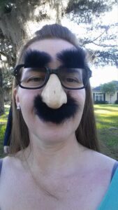 selfie of a person wearing novelty glasses with a fake nose and mustache
