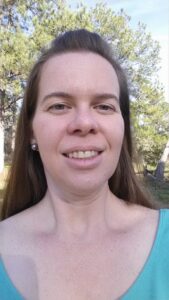 selfie of a person with long hair and a casual smile