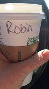 a coffee cup with the name Robin written on it