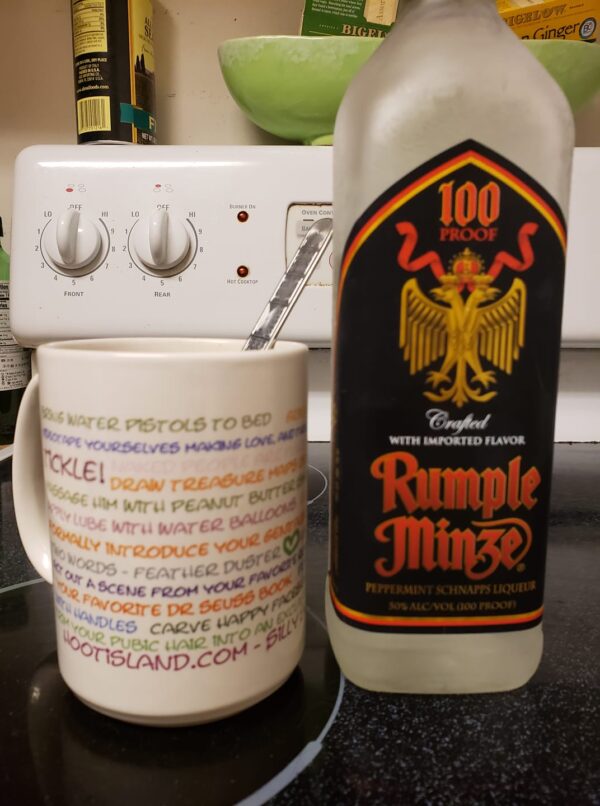a bottle of Rumple Minz and a coffee cup