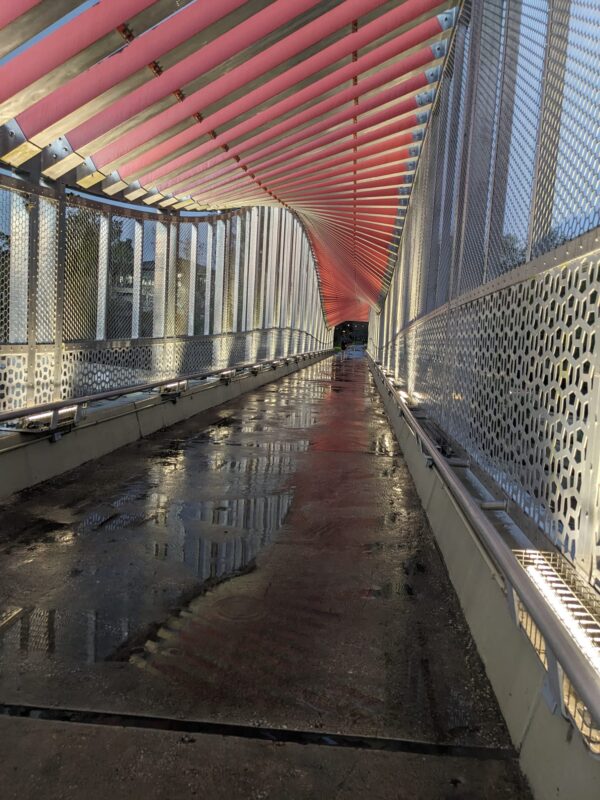 what looks like a bridge covered with an undulating metal roof