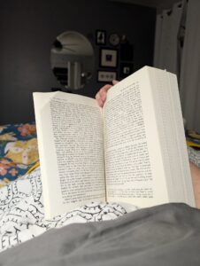 a thick book is propped open to an early page