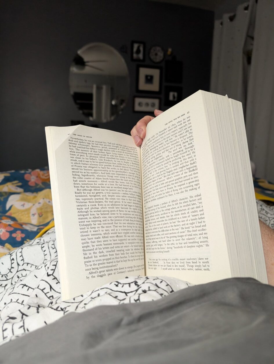 a thick book is propped open to an early page