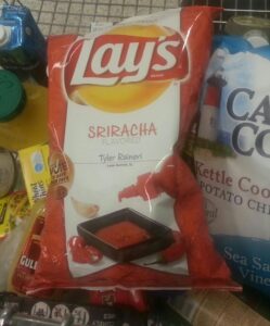 a bag of Lays sriracha flavored potato chips
