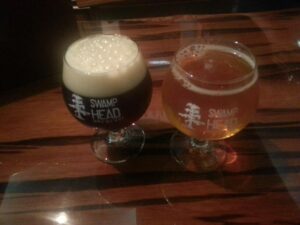 two snifter glasses of beer