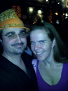a blurry selfie of two people in some kind of bar