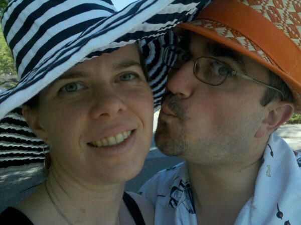 selfie of two people with unusual hats