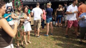 a group of people at an outdoors event involving beer tents