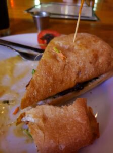 there is half a sandwich left on a plate