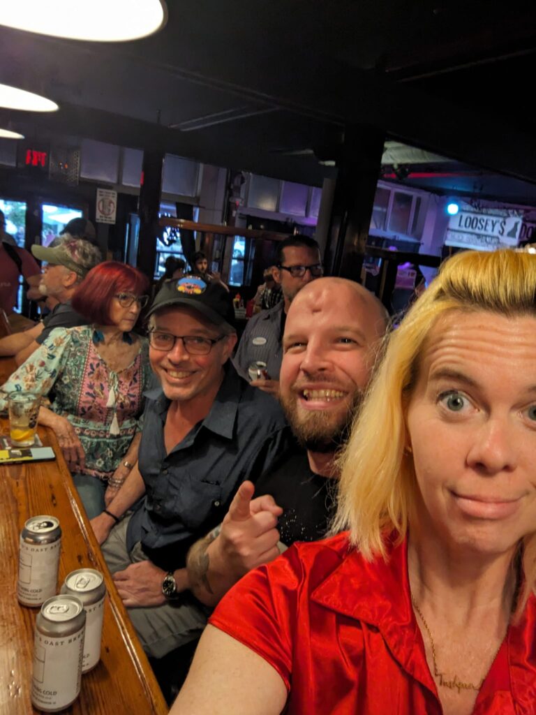 selfie with a group of people sitting at a par