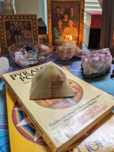 a table is covered with variety and a stone pyramid