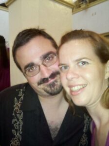 blurry selfie of two people at a semi-casual event