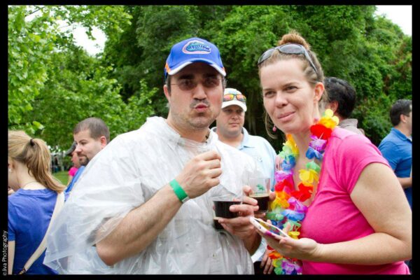 two people at an outdoors event are making weird faces