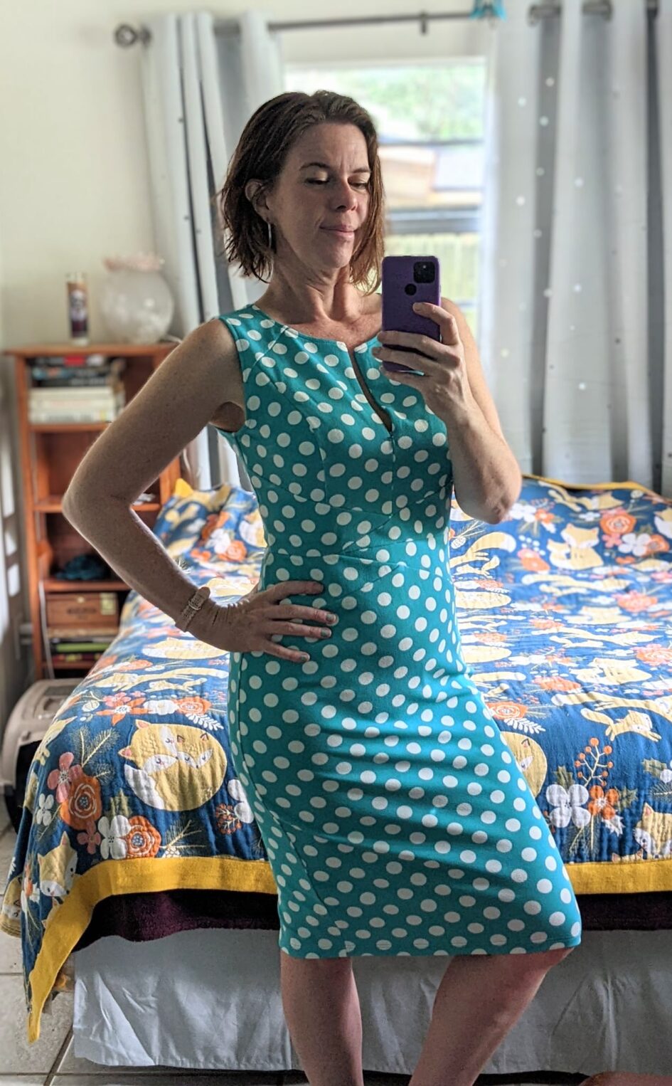 selfie of a person with a dress wit big polka dot on it