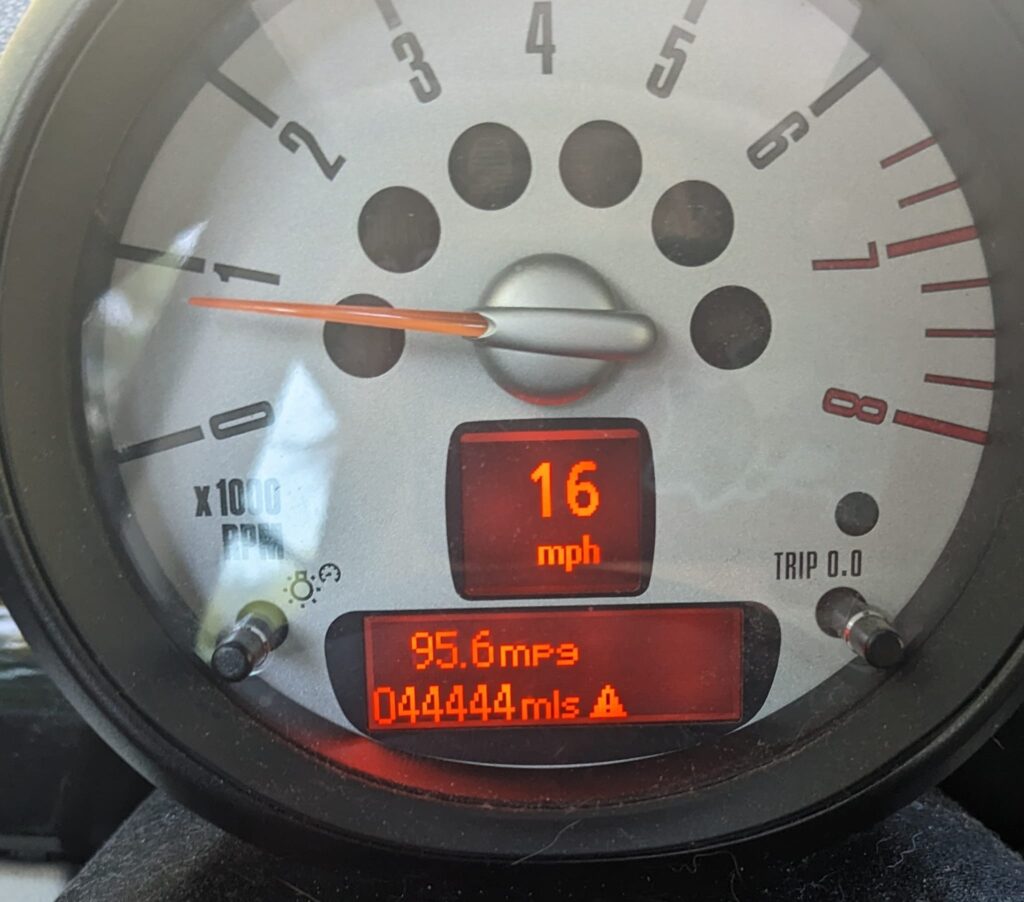 a speedometer with the odometer inset reading 444444 miles