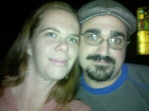 two people are taking a selfie in a dark place and the camera flash is very bright